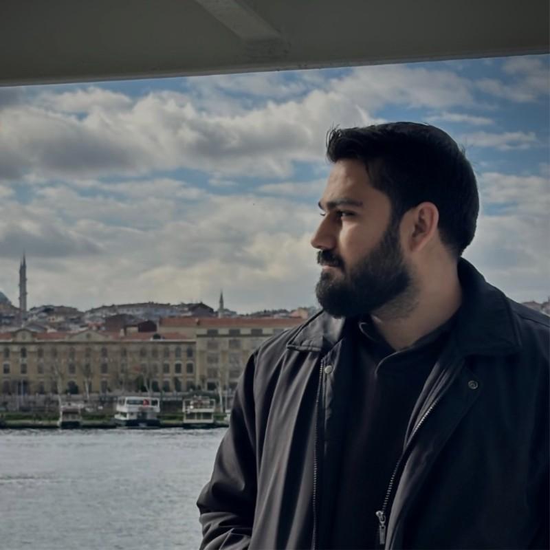 A professional portrait of Kozhyar Rauf